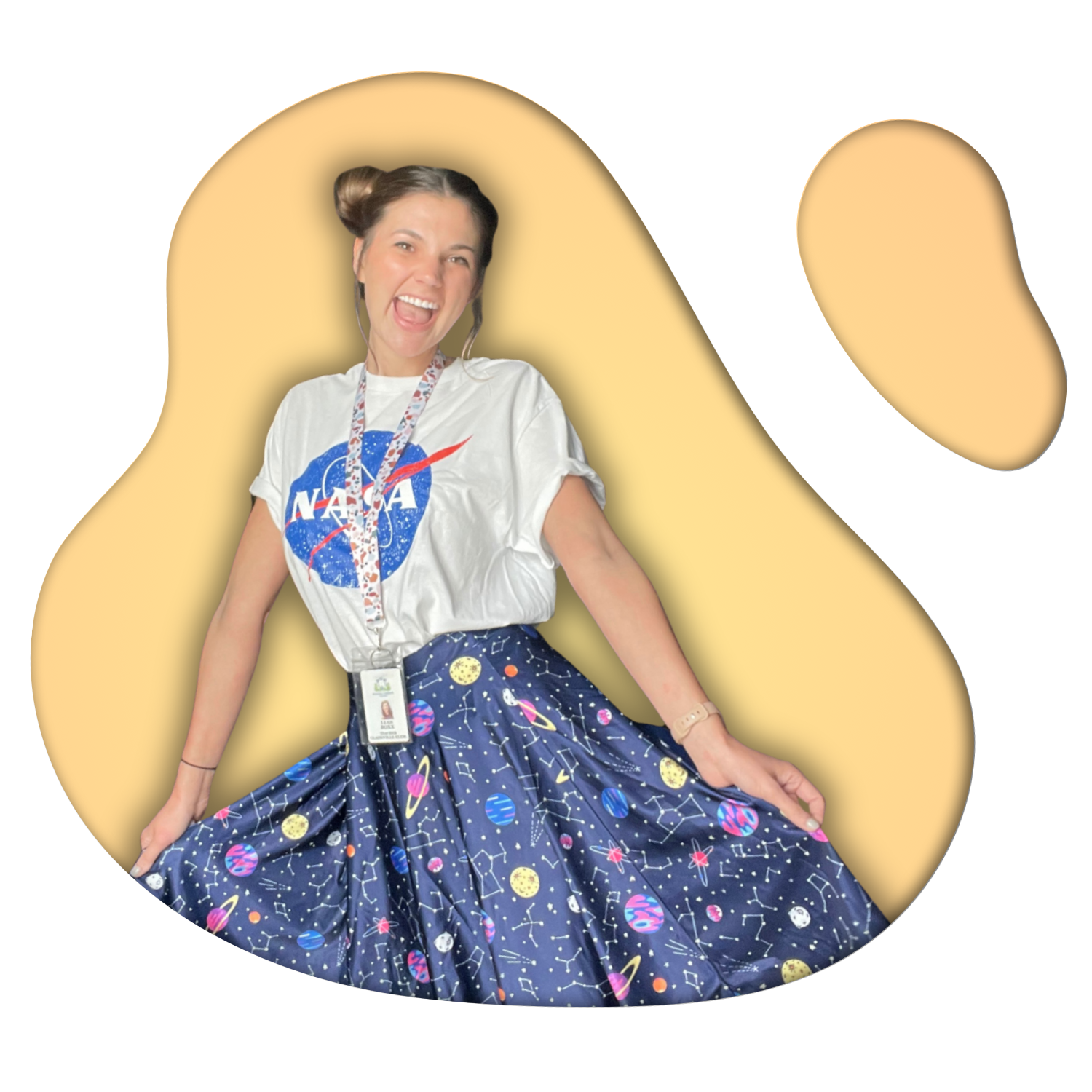 Leah Boxx Sepulveda, educator, in a NASA t-shirt and space-themed skirt, smiling at the camera